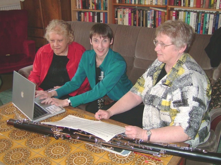 Picture of trio working at a computer